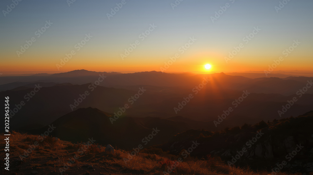 Obraz premium Sunset mountain sunrise horizon glowing sky warm light golden rays