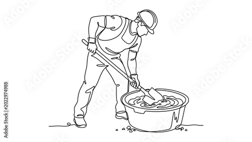 A construction worker mixing cement.