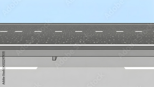 empty city street with asphalt road white dashed lines and gray concrete sidewalk under blue sky