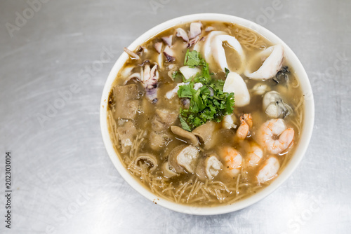 Bild auf Leinwand Delicious vermicelli with shrimps,oysters,cuttlefish and pork intestine