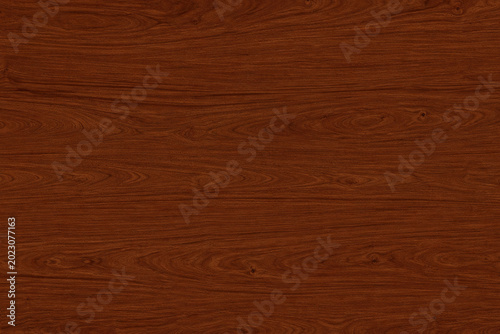 Photos Mahogany wood texture with deep reddish brown tones and rich flowing grain