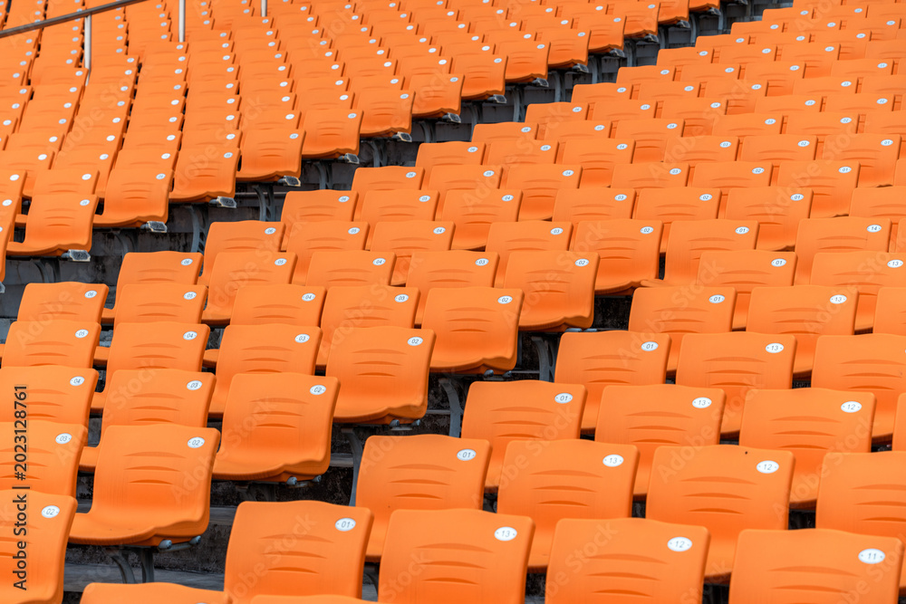 Fototapeta premium Empty Orange Spectator Seats in Stadium
