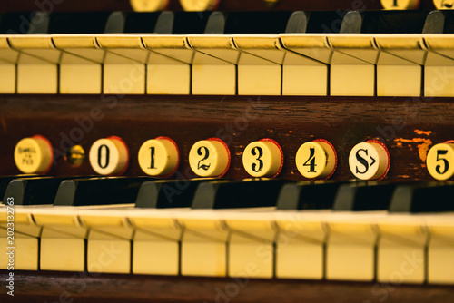 Slika na platnu Close-up shot of the keyboard of Boston Emmanuel Casavant Opus 700 pipe organ inside Xiamen Gulangyu Pipe Organ Art Center, showing delicate musical details