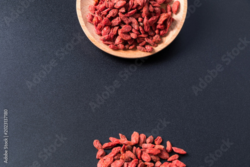 Bild auf Leinwand Dried Goji Berries on Dark Background