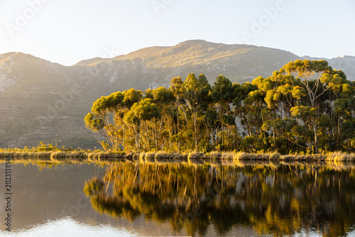 placid pond at sunset, overlooking Klein Mountains, Stanford, South Africa