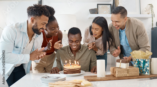 Bild auf Leinwand Applause, friends and man with cake for birthday, party and celebration with candles in home