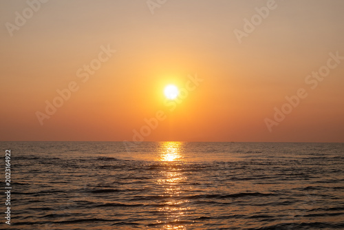 Beautiful sunset over the sea. The sun goes down over the sea.