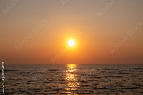 Beautiful sunset over the sea. The sun goes down over the sea.