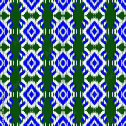 Geometric Ikat Seamless Pattern in Blue and Green, Traditional Ethic Tribal Motif Background for Textile and Wallpaper.