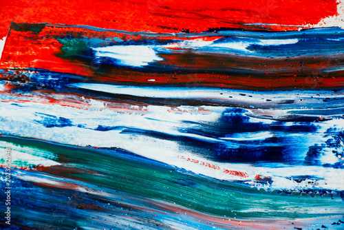 Yellow, green and blue abstract oil paint splatter