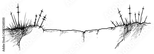 Foto Barbed wire fence on trench edge in vintage woodcut style