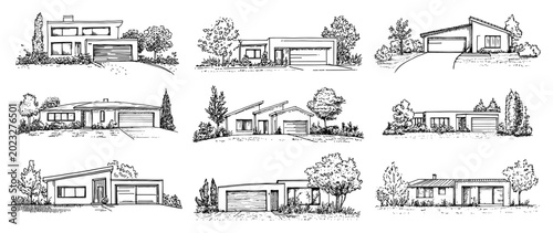 Modern residential houses with garages and landscaped gardens in clean architectural style