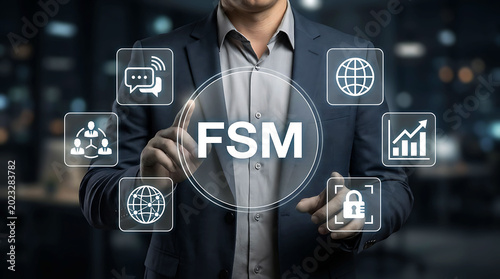 Business professional touching virtual screen with acronym FSM concept