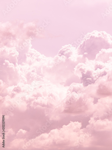 Soft pastel white pink purple cumulus clouds filling sky minimal dreamy atmospheric background nature weather concept