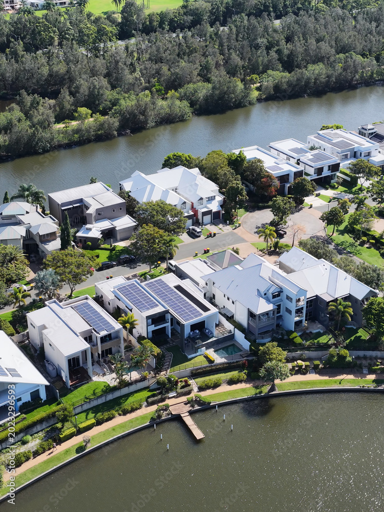 Fototapeta premium Aerial View of Modern Waterfront Homes in Emerald Lakes Gold Coast