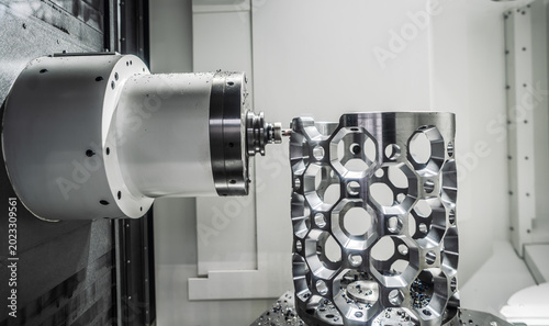 CNC milling machine processing an aluminum aerospace part.