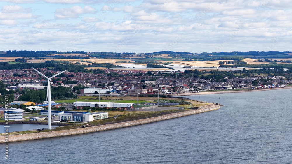 Obraz premium Aerial View of a Wind Turbine on the Dundee Coastal Waterfront
