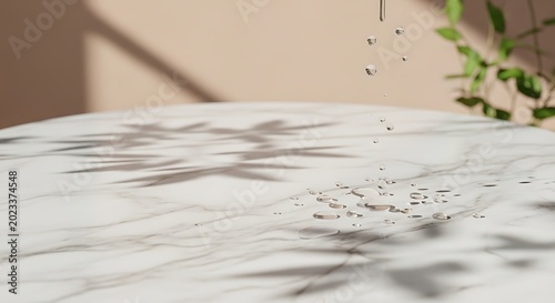 Water drops falling onto a clean cararra marble surface with soft leaf shadows in a minimalist interior design concept for a luxury cosmetic product background