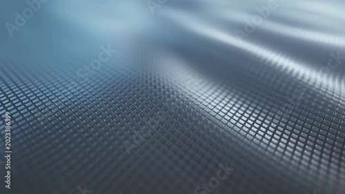 Abstract futuristic surface with flowing wave motion and grid pattern, blue digital background, seamless loop footage.