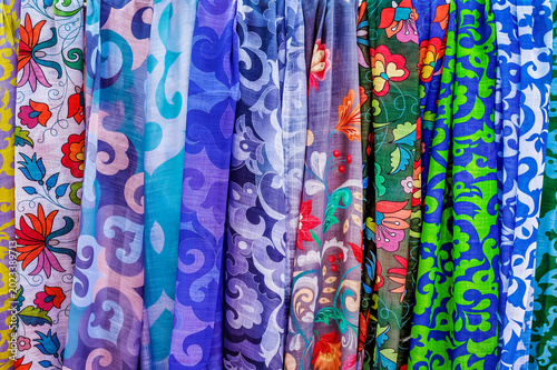 Cuadro en lienzo The sale of colorful women's kerchiefs at a street festival.