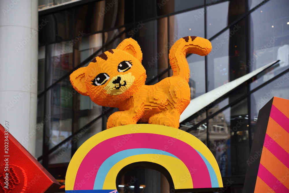 Fototapeta premium Shanghai, China - 2nd April 2026: yellow cat, large pet made of Lego blocks in Nanjing Road, Shanghai.