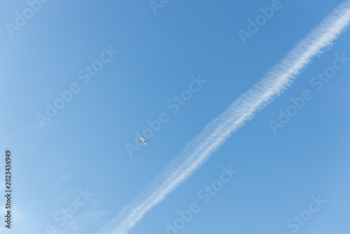 airplane trail in the blue sky