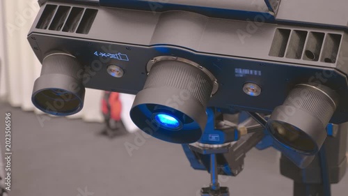 An industrial 3D scanner captures data from a part rotated on specialized equipment. Closeup. Shot in motion
