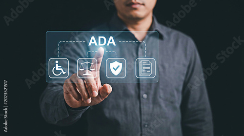 Person interacting with digital touch screen display showing ada compliance icons in this professional studio photo
