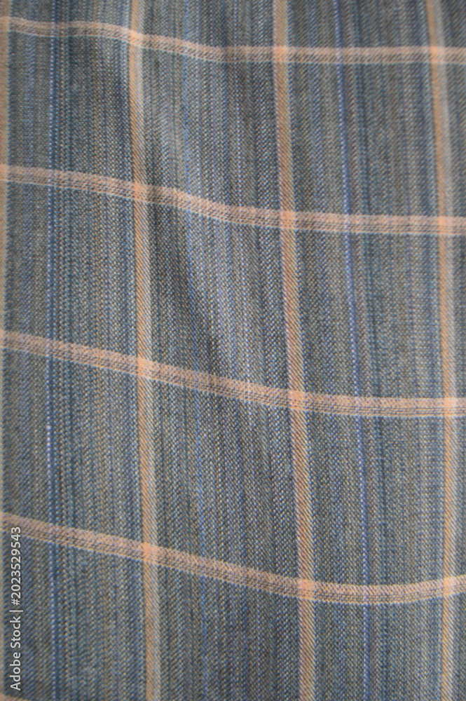 Fototapeta premium Close-Up Blue Plaid Fabric Texture With Orange Stripes — Woven Textile Pattern For Fashion And Decor