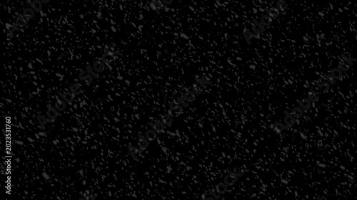 Snow falling on black background creating winter storm atmosphere with heavy flakes drifting across screen slowly.