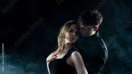 Obraz na płótnie Young couple embracing intimately, creating a romantic, passionate, and mysterio