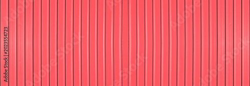 Foto pink red corrugated metal wall background texture with vertical lines and rivets