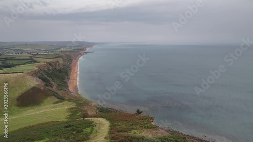 Cinematic Aerial Drone View of Coastal Cliffs and Pebble Beach on Jurassic Coast Dorset England
