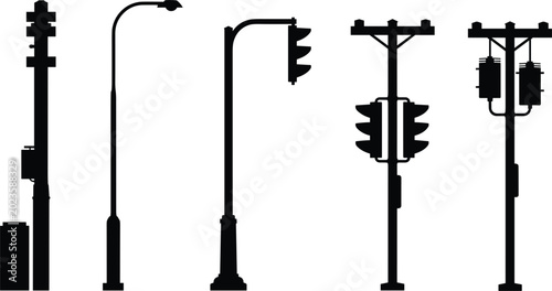 Valokuva Collection of black silhouettes of utility poles street lights and traffic signa