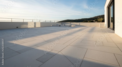 Modern terrace with geometric paving and scenic view