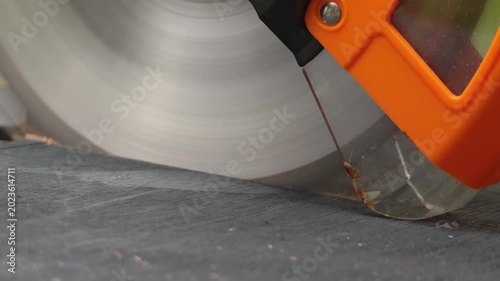 Close-up of cutting wood with an electric saw. Woodwork, carpentry