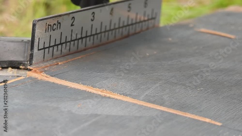 Close-up of cutting wood with an electric saw. Woodwork, carpentry