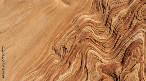 Vászonkép Top view of wavy sandstone texture background with natural patterns
