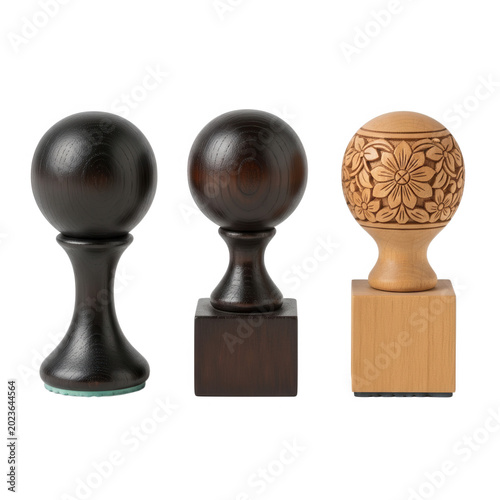 Three decorative wooden finials with intricate geometric designs