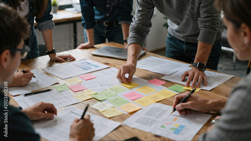 Team working on project with sticky notes