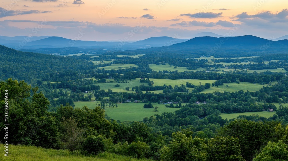Fototapeta premium Panoramic mountain views at dusk showcasing stunning light contrasts and expansive valley vistas