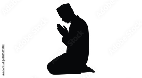 Bild auf Leinwand Praying man in traditional hat silhouette