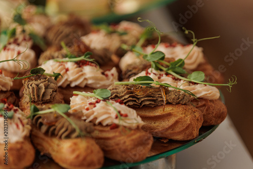 Cuadro en lienzo Close-up of savory eclairs with liver pate and microgreens