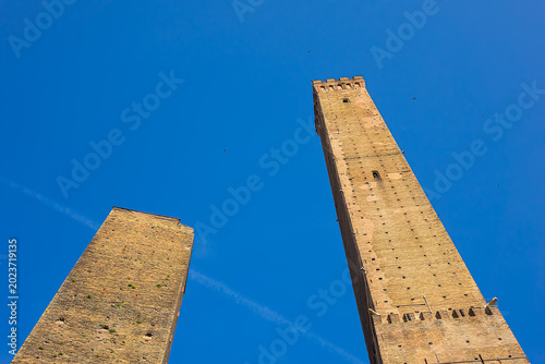 Two Towers (Due Torri, 1109 – 1119), symbols of medieval Bologna. The taller one is the Asinelli; the smaller, with a greater lean, is the Garisenda. BOLOGNA, ITALY.