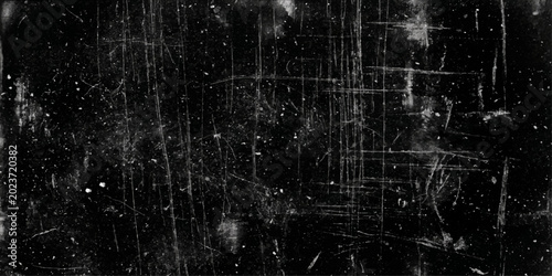 Fotografie An abstract black and white grunge background texture featuring a vintage dark w