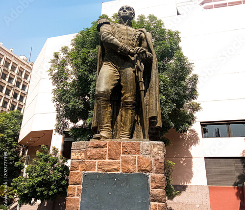 A photograph taken in downtown Cairo, near Tahrir Square and the Semiramis Hotel. The statue depicts the Venezuelan leader and liberator in his military uniform, leaning proudly on his sword.