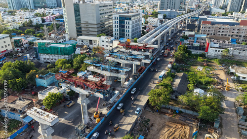 Canvastavla Aerial view of metro rail construction over busy city road with elevated track a