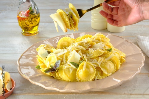 Cuadro en lienzo Delight in the sight of perfectly cooked ravioli layered with fresh herbs and cheese, ready to be enjoyed