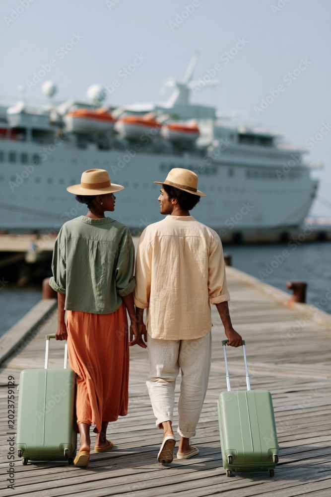 Obraz premium Couple walking hand in hand on a pier with matching suitcases toward a cruise ship for travel banner and romantic vacation background