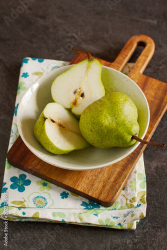 Fresh ripe organic summer pears on rustic wooden table	